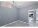 Room with tile floor, neutral walls, door to backyard pool at 9930 San Diego Way, Port Richey, FL 34668