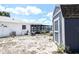View of the backyard featuring a shed, and an enclosed in-ground pool at 9942 Woodridge Ct, Port Richey, FL 34668