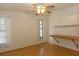 Bedroom with built in desk and cabinets plus a bright ceiling fan at 9942 Woodridge Ct, Port Richey, FL 34668