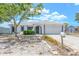 Inviting one-story home with mature trees, mailbox and a two-car garage with classic curb appeal at 9942 Woodridge Ct, Port Richey, FL 34668