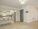Open-concept kitchen with stainless steel appliances and bar seating area at 9942 Woodridge Ct, Port Richey, FL 34668