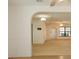 Bright and spacious living room boasts an archway, carpet flooring, and natural light at 9942 Woodridge Ct, Port Richey, FL 34668