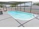 A beautiful screened-in pool with clean water and a spacious deck area for relaxing at 9942 Woodridge Ct, Port Richey, FL 34668