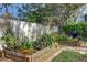 Lush vegetable garden featuring raised beds and gravel-lined walkways at 10910 Winter Oak Pl, Tampa, FL 33618