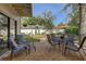 Relaxing backyard patio with a table and chairs surrounded by lush landscaping at 10910 Winter Oak Pl, Tampa, FL 33618