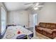 Bonus room with air hockey table, sofa, and ceiling fan is ready for fun and relaxation at 10910 Winter Oak Pl, Tampa, FL 33618