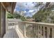 This deck offers a view of the community with a white railing and wood flooring at 10910 Winter Oak Pl, Tampa, FL 33618