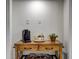 Wooden table with coffee maker in a hallway of a home at 10910 Winter Oak Pl, Tampa, FL 33618