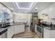 Bright kitchen with stainless steel appliances and granite countertops at 10910 Winter Oak Pl, Tampa, FL 33618