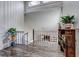 Landing featuring hardwood floors, a plant, and wooden shelving unit at 10910 Winter Oak Pl, Tampa, FL 33618