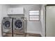 Laundry room with modern washer and dryer at 10910 Winter Oak Pl, Tampa, FL 33618