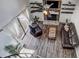 Living room with hardwood floors, leather sofas, and a stone fireplace at 10910 Winter Oak Pl, Tampa, FL 33618
