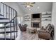 Beautiful Living Room with hardwood floors, a spiral staircase and modern decor at 10910 Winter Oak Pl, Tampa, FL 33618