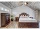 Main bedroom with hardwood floors, wood furniture, and natural light at 10910 Winter Oak Pl, Tampa, FL 33618