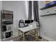 Bright office space featuring a large desk, floating shelves, and a built-in bookcase at 10910 Winter Oak Pl, Tampa, FL 33618