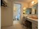 Cozy bathroom with vanity area and adjacent toilet and bathtub at 11224 Yewtree Ave, Port Richey, FL 34668