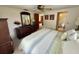 Spacious bedroom featuring a comfortable bed, dresser, and access to an en-suite bathroom at 11224 Yewtree Ave, Port Richey, FL 34668