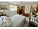 Comfortable bedroom features a window, closet, and coordinated furnishings at 11224 Yewtree Ave, Port Richey, FL 34668
