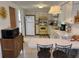 Functional kitchen featuring tile floors, white cabinets, and a breakfast bar with seating at 11224 Yewtree Ave, Port Richey, FL 34668