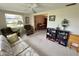 Inviting living room with large window, comfortable seating, and views into dining area at 11224 Yewtree Ave, Port Richey, FL 34668