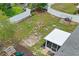 Aerial view of expansive backyard, fenced-in yard with playset, screened in lanai at 1219 Aladdin Rd, Spring Hill, FL 34609