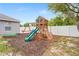 Backyard showcasing playset and mulch at 1219 Aladdin Rd, Spring Hill, FL 34609