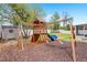 Backyard view of playset, shed, and fenced perimeter at 1219 Aladdin Rd, Spring Hill, FL 34609