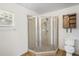 Corner shower unit featuring tiled walls and a sliding glass door at 1219 Aladdin Rd, Spring Hill, FL 34609