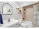Stylish bathroom with elegant mirror, modern sink, bathtub and colorful shower curtain at 1219 Aladdin Rd, Spring Hill, FL 34609