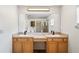 Large mirror and double vanity in a neutral-toned bathroom at 1219 Aladdin Rd, Spring Hill, FL 34609