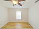 Empty bedroom featuring hardwood floors, a ceiling fan and a window at 1219 Aladdin Rd, Spring Hill, FL 34609