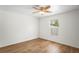 Cozy bedroom featuring hardwood floors, a ceiling fan and a window at 1219 Aladdin Rd, Spring Hill, FL 34609
