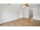 A bedroom showing an interior door and an adjacent arched entrance to a closet or bathroom at 1219 Aladdin Rd, Spring Hill, FL 34609