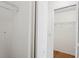 Walk-in closet features wire shelving and access to additional storage space at 1219 Aladdin Rd, Spring Hill, FL 34609