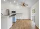 Kitchen with stainless steel appliances, center island, and access to outdoor patio at 1219 Aladdin Rd, Spring Hill, FL 34609