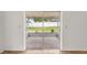View of screened lanai with access to a well-maintained backyard through sliding glass doors at 1219 Aladdin Rd, Spring Hill, FL 34609