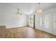 Bright open living room features tile flooring, decorative lighting, and neutral walls at 1219 Aladdin Rd, Spring Hill, FL 34609