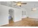 Bright living room featuring hardwood floors, high ceilings, arched doorways and decorative wall cutouts at 1219 Aladdin Rd, Spring Hill, FL 34609