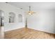 Bright and spacious living room with tile flooring, neutral paint, and ceiling fan at 1219 Aladdin Rd, Spring Hill, FL 34609