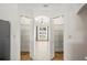 Pantry featuring open shelves, wood-look floors, and view to the front yard at 1219 Aladdin Rd, Spring Hill, FL 34609