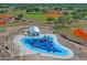 Aerial view of a community splash pad, showcasing colorful water features and play structures for Gathering fun at 1219 Aladdin Rd, Spring Hill, FL 34609