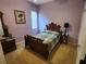 Bedroom with dark furniture, carpet floors, and purple painted walls at 12270 Clarendon Ct, Spring Hill, FL 34609