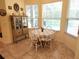Charming breakfast nook with tiled floors and views of the backyard pool at 12270 Clarendon Ct, Spring Hill, FL 34609