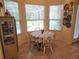 Eat-in kitchen nook with backyard pool views and lots of natural light at 12270 Clarendon Ct, Spring Hill, FL 34609