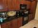 Well-equipped kitchen featuring stainless steel appliances, granite countertops, and custom wood cabinets at 12270 Clarendon Ct, Spring Hill, FL 34609