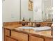 Close-up of bathroom vanity with granite countertop, faucet, and elegant decor at 1245 Coble E Rd, Spring Hill, FL 34608