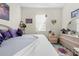 Bright bedroom with a cozy bed, soft lighting, and charming decorative accents at 1245 Coble E Rd, Spring Hill, FL 34608