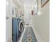 Inviting laundry room with front-load washer and dryer and stylish runner rug at 1245 Coble E Rd, Spring Hill, FL 34608