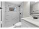 Modern bathroom featuring a tiled walk-in shower and a white quartz countertop at 13411 Lisa Dr, Hudson, FL 34667