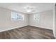 Inviting bedroom with new flooring, abundant natural light, and a modern ceiling fan at 13411 Lisa Dr, Hudson, FL 34667